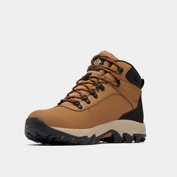 Columbia Newton Explorer hiking boots in tan and black with durable leather upper, reinforced ankle support, and rugged outsole, side view.