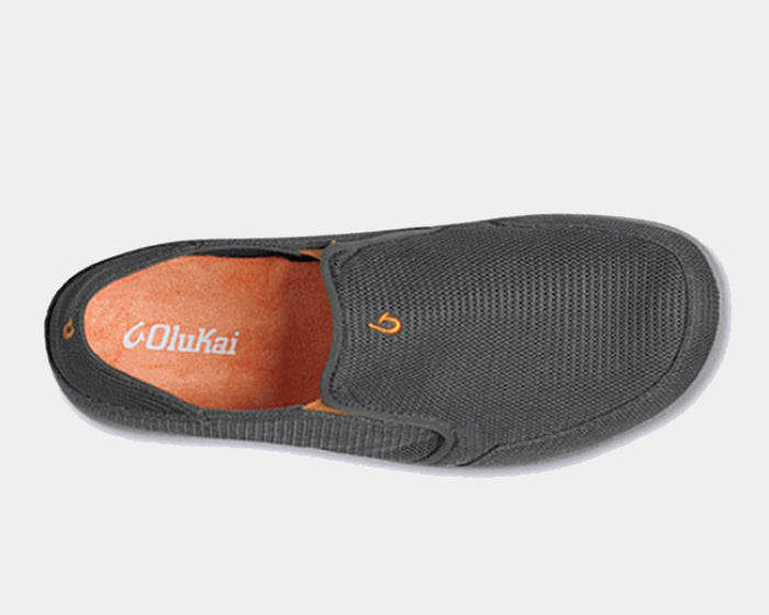 OluKai Nohea Mesh slip-on shoes in charcoal gray with mesh upper, orange insole, and embroidered logo, top view.