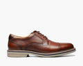 Florsheim Norwalk Cap Toe Oxford dress shoes in brown leather with stitched cap toe and cushioned sole, side view.