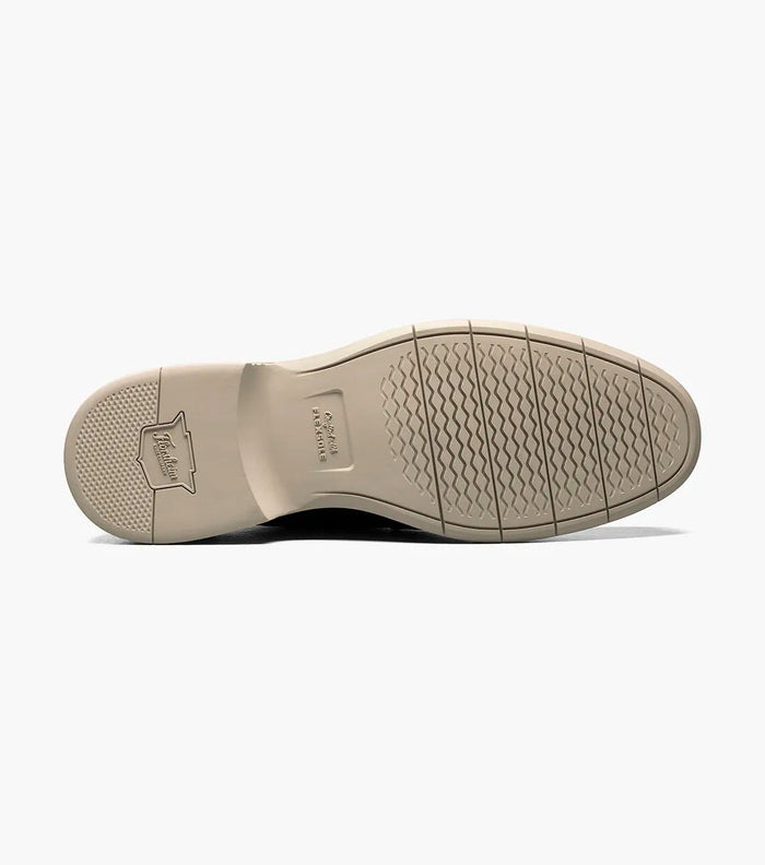 Florsheim Norwalk Cap Toe Oxford shoe outsole in beige featuring textured grip pattern and embossed logo.