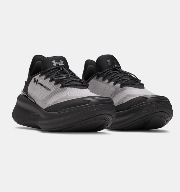 Under Armour Nova SlipSpeed™ shoes in black and gray with a slip-on design and cushioned sole, front angled view.
