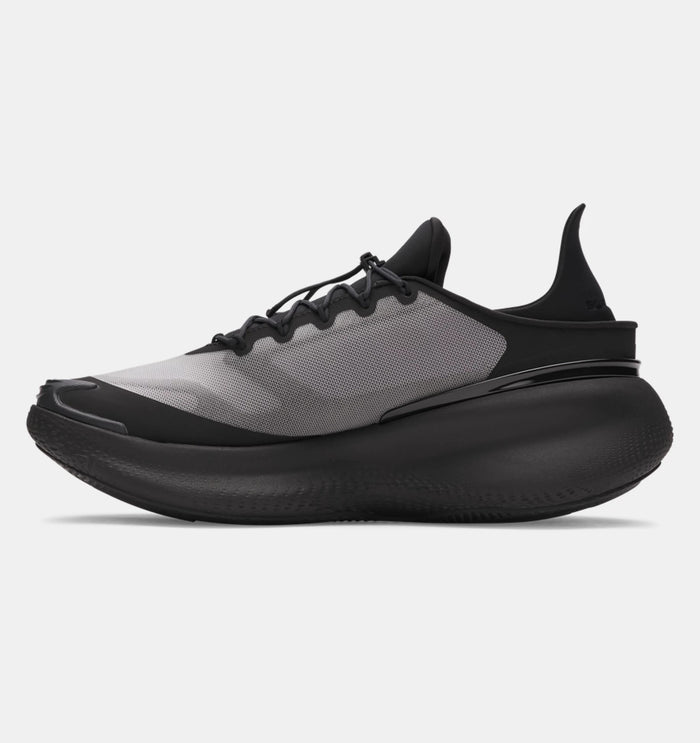 Under Armour Nova SlipSpeed™ running shoes in black and gray with mesh upper and slip-on design, side view.