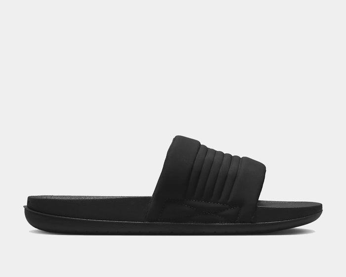 Nike Offcourt Adjustable Slide sandals in black with a padded strap and contoured footbed, side view.