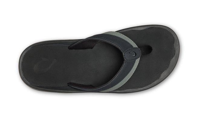 OluKai Ohana KOA sandals in black with a durable strap and textured footbed, top view.