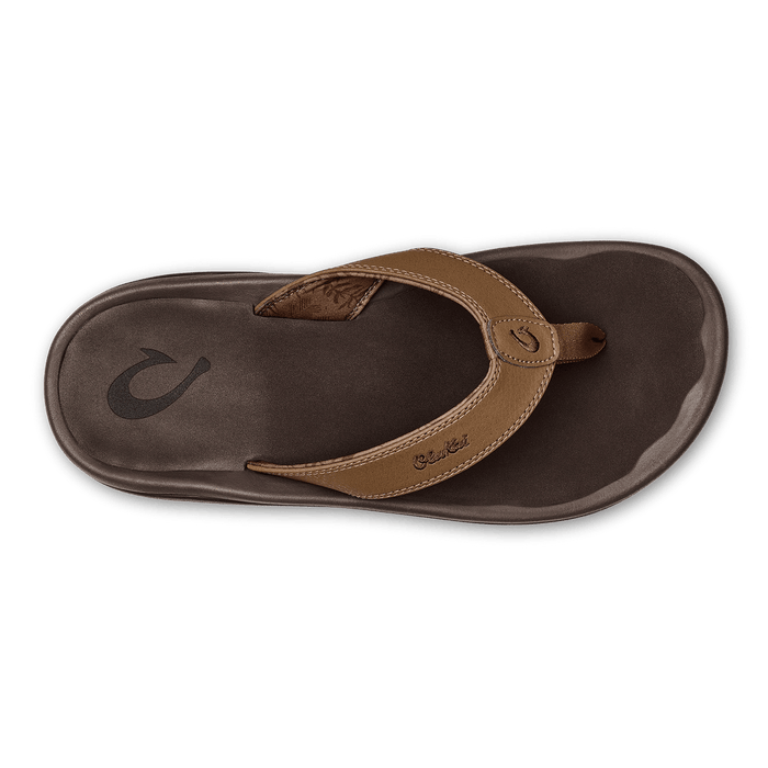 OluKai Ohana sandals with brown synthetic straps and dark brown cushioned footbed, top view.