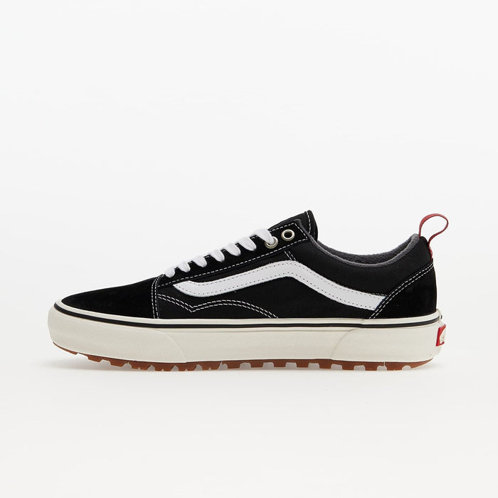 Vans Old Skool MTE sneakers in black suede and canvas with white stripe, rugged outsole, and red heel pull tab, side view.