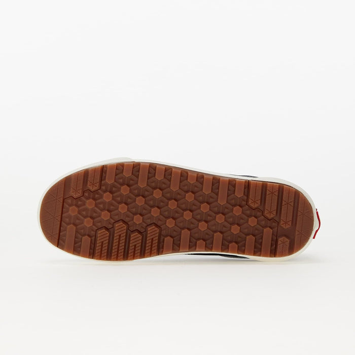 Vans Old Skool MTE shoes outsole in textured brown rubber with multidirectional tread pattern, bottom view.