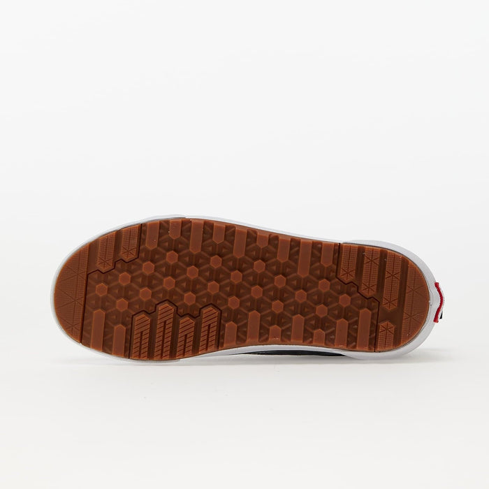 Vans Old Skool MTE shoes outsole with textured tread pattern and durable brown rubber, bottom view.