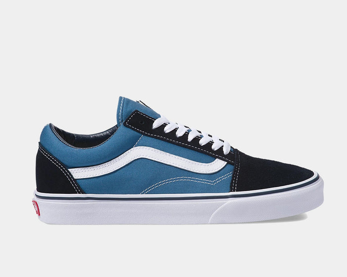 Vans Old Skool sneakers in black and navy blue with white side stripe, suede and canvas upper, and white rubber sole, side view.