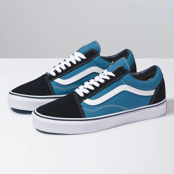 Vans Old Skool sneakers with a blue canvas upper, black suede overlays, white jazz stripe, and white rubber sole, side view.