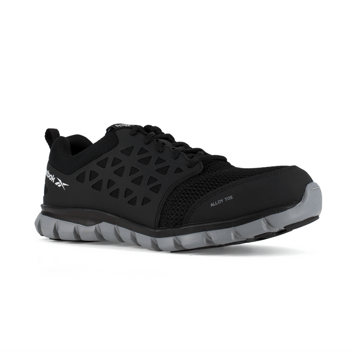 Reebok Work Sublite Cushion Work alloy toe shoes in black with mesh upper and lightweight gray outsole, side angle view