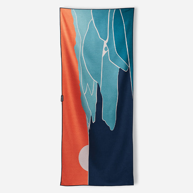 Nomadix Original Towel Big Sur, quick-drying microfiber towel with blue, orange, and white abstract Big Sur design, front view