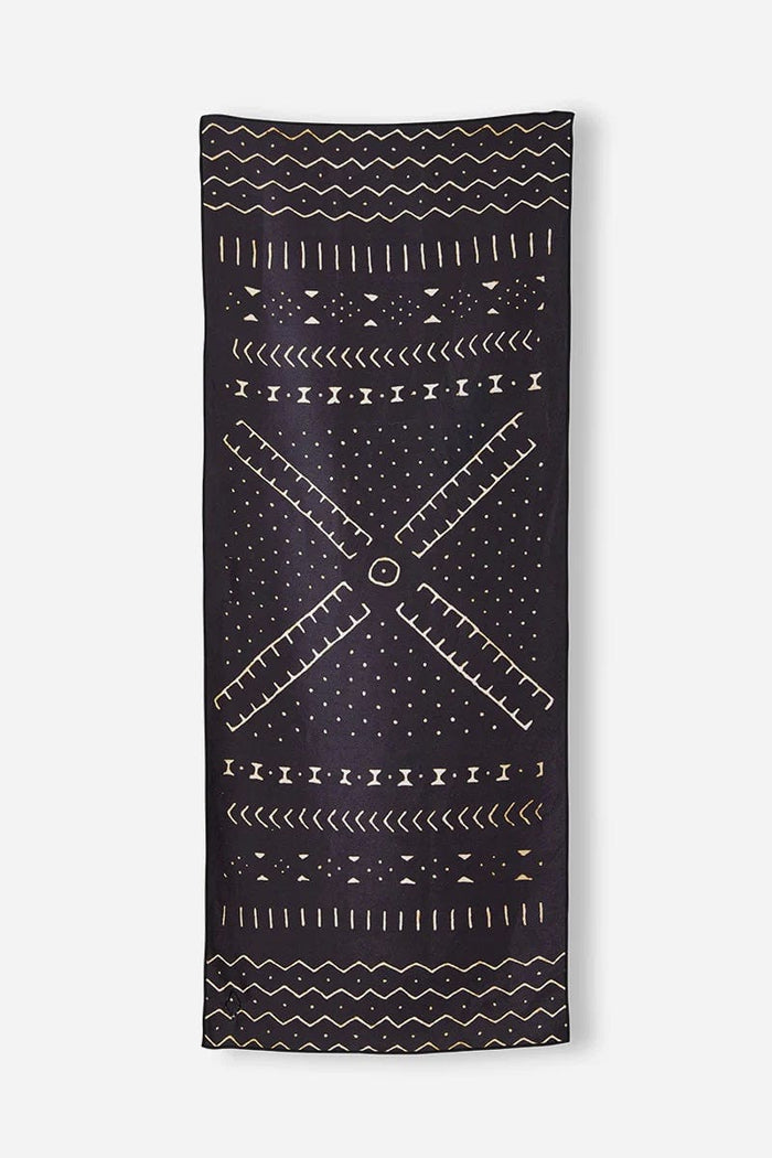 Nomadix Original Towel in black with geometric tan patterns, lightweight and versatile, front view.