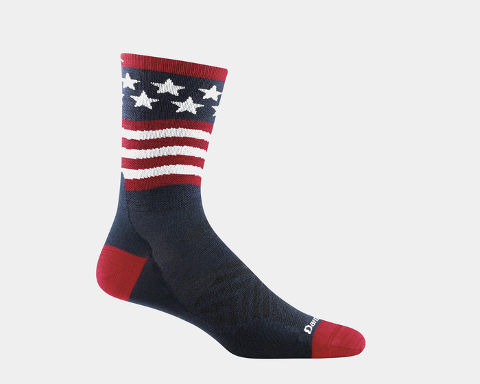 Darn Tough Patriot Micro Crew Ultra-Lightweight Running socks in navy blue with red and white striped and star pattern, side view.