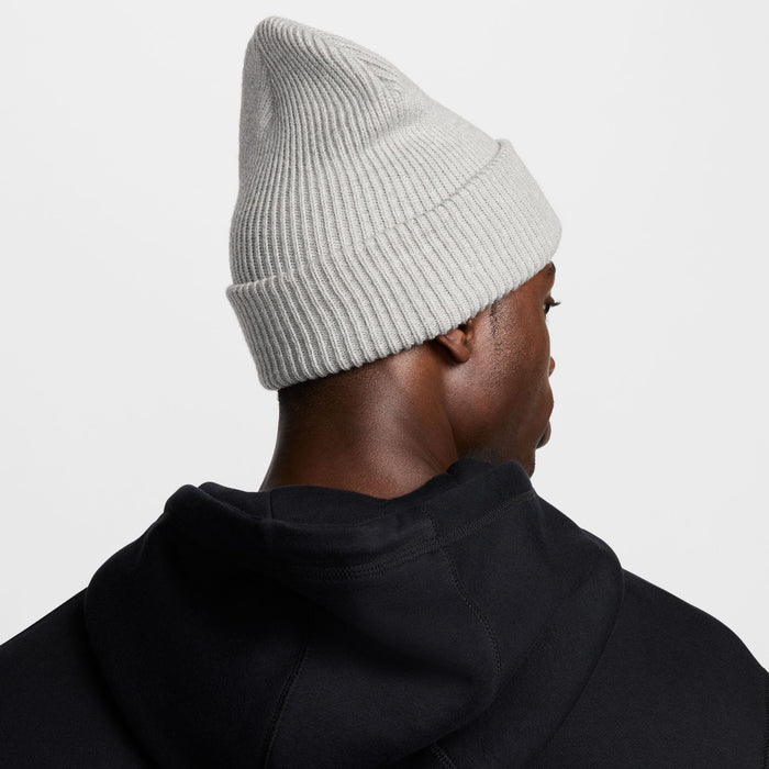 Nike Peak beanie in light gray with ribbed knit texture and cuffed design, back view.