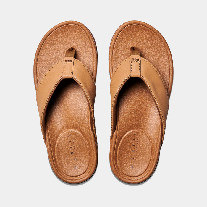 Reef Phantom Bronzer sandals in light brown with synthetic straps, cushioned footbed, and durable outsole, top view.