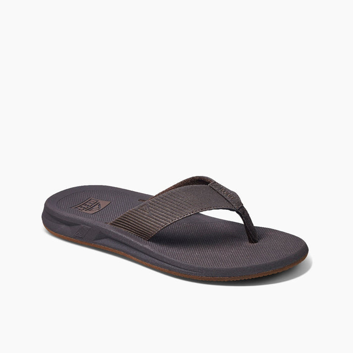 Reef Phantom II sandals in dark brown with textured straps, cushioned footbed, and durable outsole, angled side view.