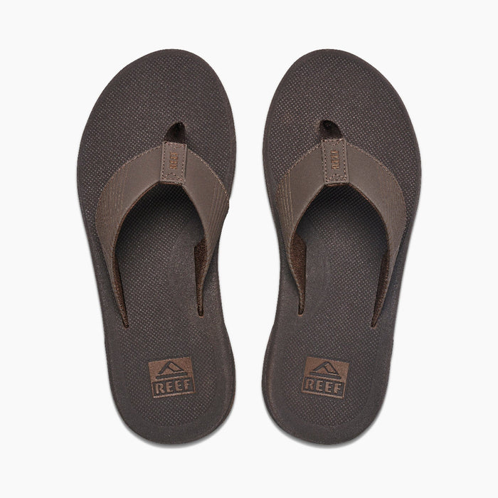 Reef Phantom II flip-flops in dark brown with textured footbeds and synthetic straps, top view.