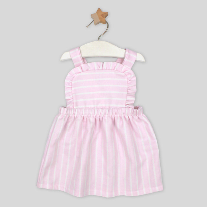 Pink and white striped dress on a hanger against a gray background