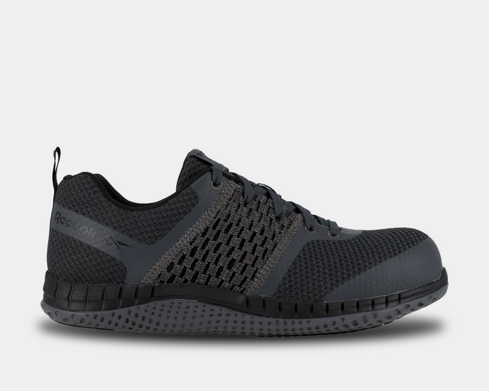 Reebok Work Print Work ULTK work shoes in dark gray with textured mesh upper and slip-resistant outsole, side view.