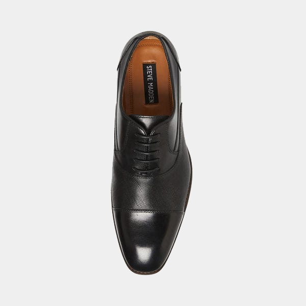Steve Madden Proctor dress shoe in black leather with cap-toe design and laced upper, top view.