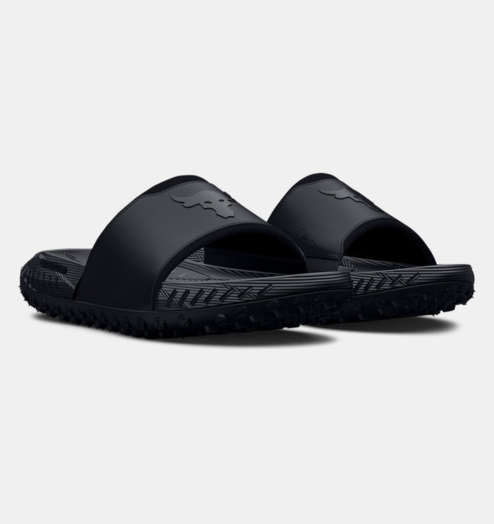 Under Armour Project Rock 3 Slides in black featuring Bull logo, textured footbed, and rugged outsole, angled front view.