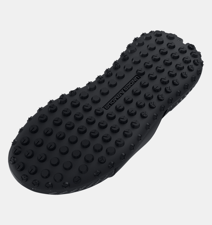 Under Armour Project Rock 3 Slides outsole in black with textured grip pattern and embossed branding, bottom view.