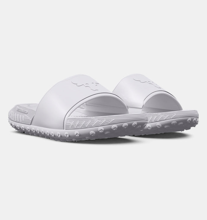Under Armour Project Rock 3 Slides in all-white with textured strap, foam footbed, and treaded outsole, angled front view.
