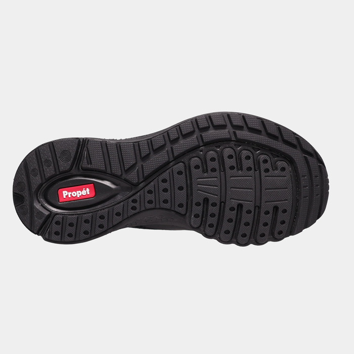 Propét One Velocity Step-In Sneaker outsole featuring durable black rubber with tread patterns and branded logo detailing.