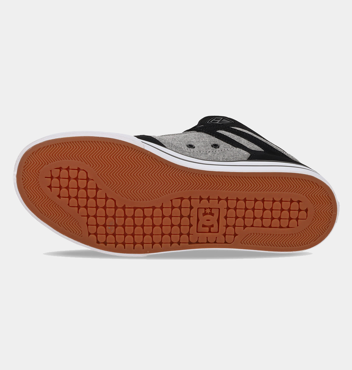 DC Footwear Pure High Top WC high-top shoes outsole view featuring gum rubber tread and branding detail.