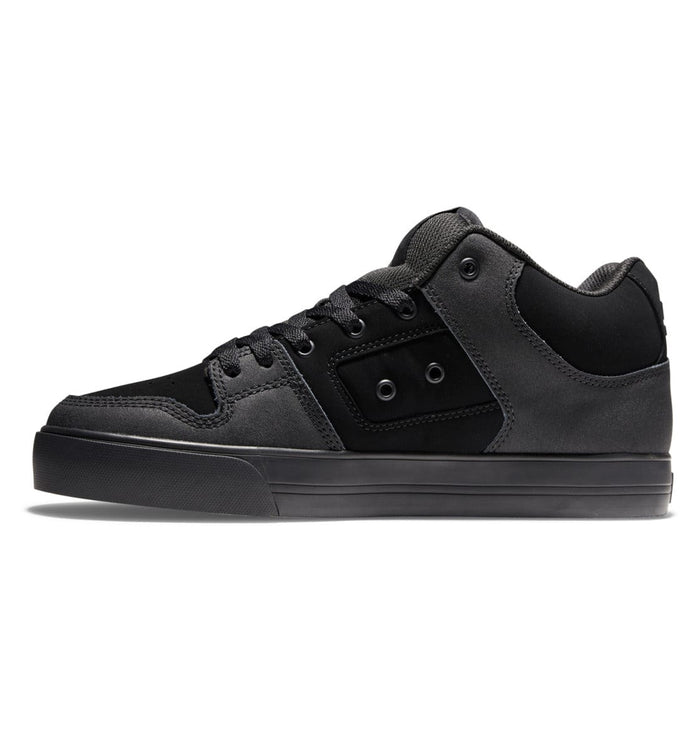 DC Footwear Pure Mid sneakers in black and charcoal gray with suede and leather upper, side view showcasing padded collar and durable outsole.