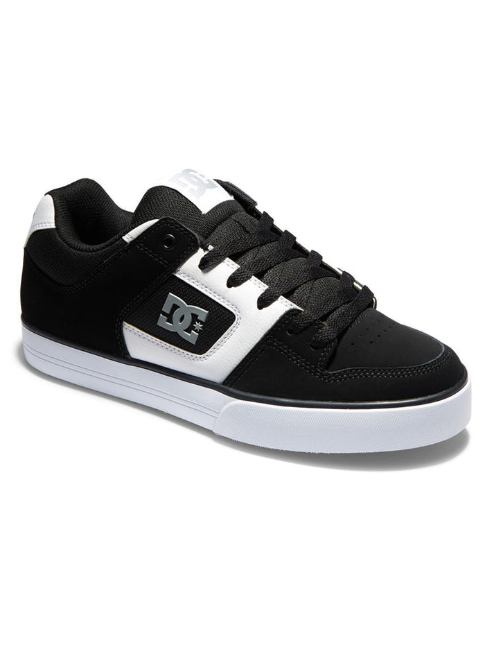 DC Footwear Pure skate shoes in black and white with padded collar, durable upper, and DC logo detailing, side angle view.