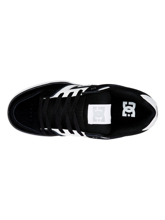 DC Footwear Pure skate shoes top view showcasing black and white color scheme, padded tongue, and lace-up closure.