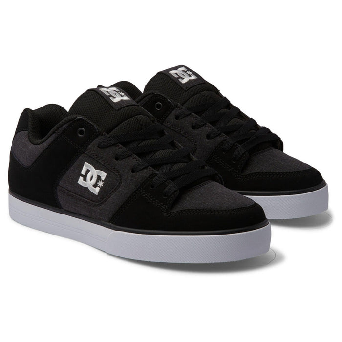 DC Footwear Pure skate shoes in black and gray with stitched detailing, padded tongue, white outsole, front angled view.