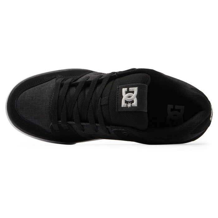 DC Footwear Pure skate shoes in black with padded tongue featuring logo and lace-up closure, top view.