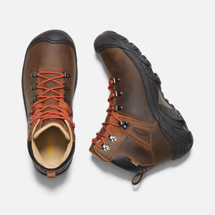 Keen Pyrenees hiking boots in brown leather with red laces, rugged black outsole, and padded collar, top and side view.
