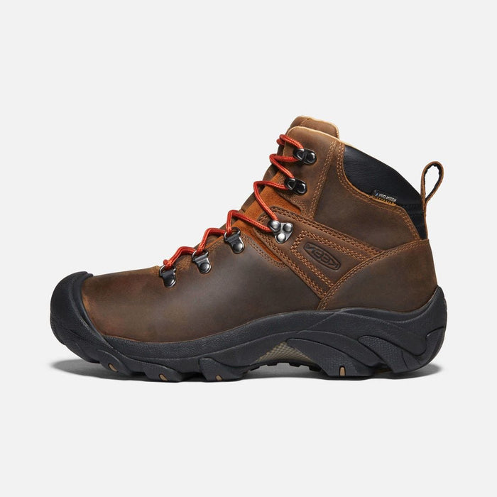 Keen Pyrenees hiking boots in brown leather with red laces, robust outsole, and ankle support, side view.