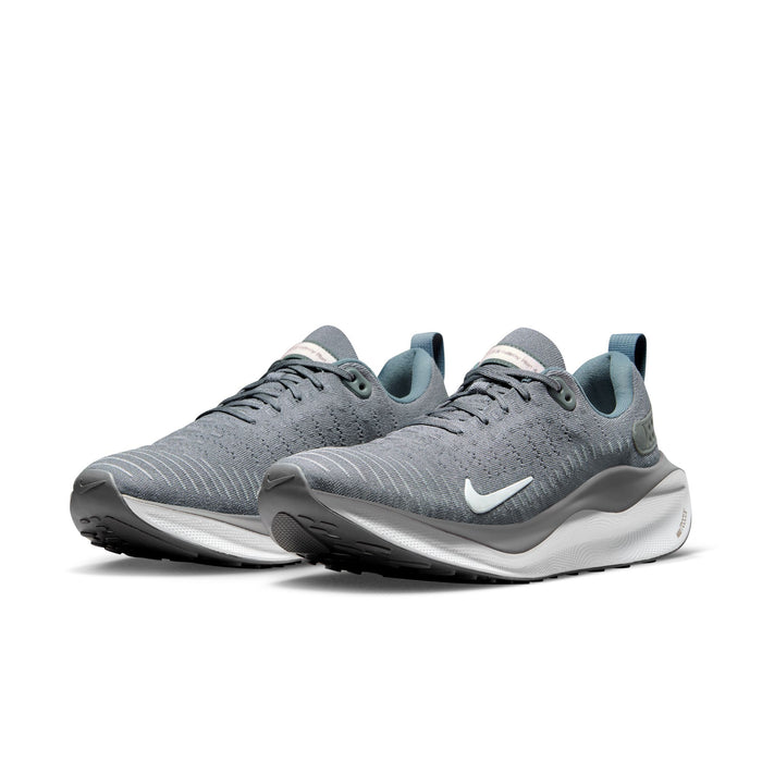 Nike React Infinity Run 4 running shoes in gray with breathable mesh upper, white midsole, and black outsole, front angle view.