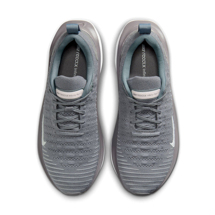 Nike React Infinity Run 4 running shoes in gray with breathable knit upper and white swoosh logo, top view showing lace system.