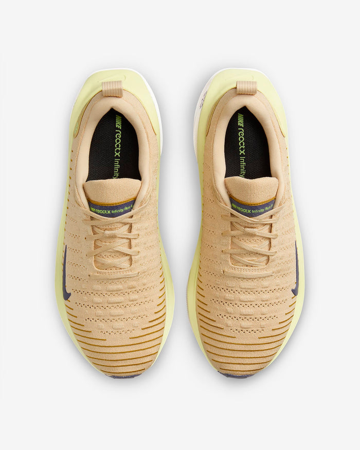 Nike React Infinity Run Flyknit 4 running shoes in beige and pastel yellow with breathable Flyknit upper and lace-up closure, top view.