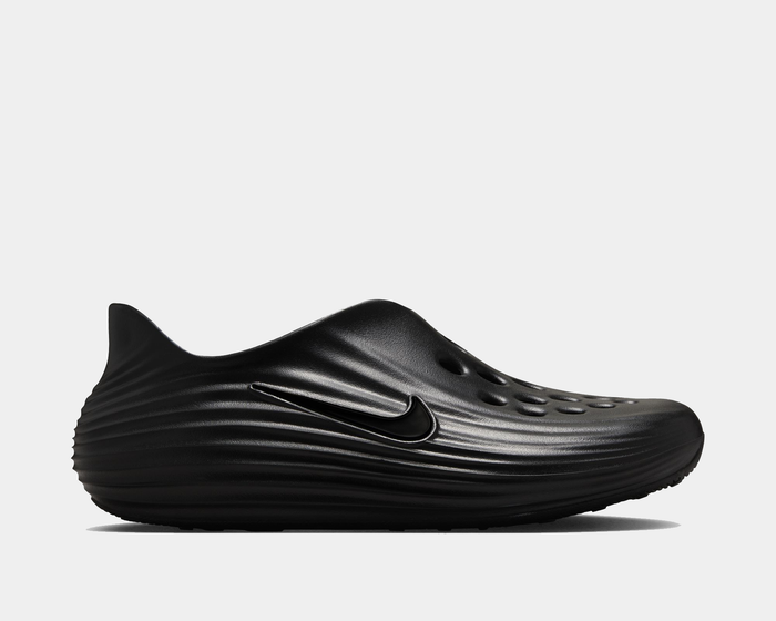 Nike ReactX Rejuven8 slip-on shoes in black with a textured rippled design, perforations for breathability, and side view showcasing the streamlined silhouette and iconic Nike Swoosh.