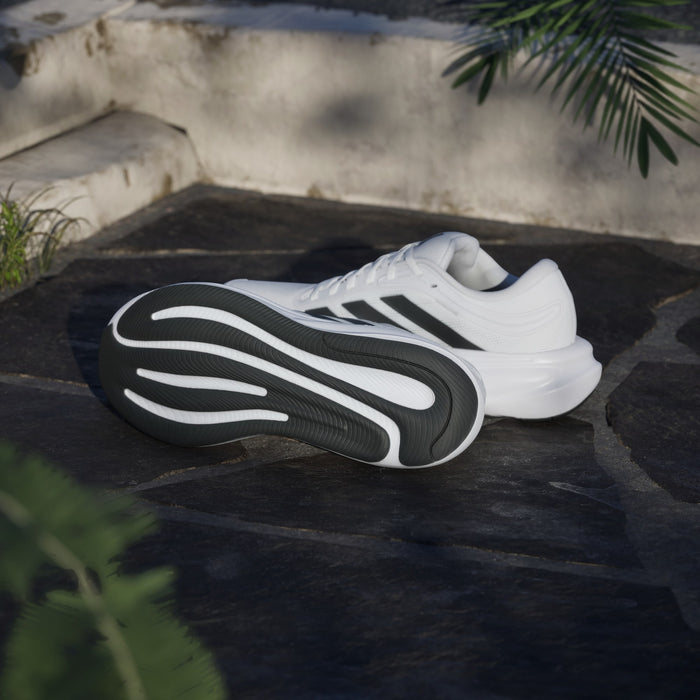 Adidas Response 2 running shoes in white with black outsole and signature three-stripe design, sole and side view.