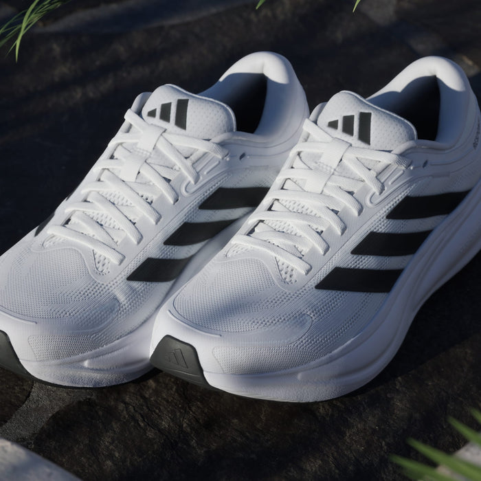Adidas Response 2 running shoes in white with black three-stripe design, breathable mesh upper, and cushioned midsole, front angle view.