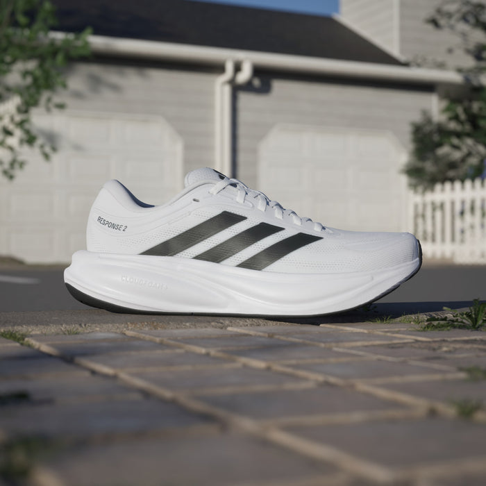 Adidas Response 2 running shoes in white with black stripes and Cloudfoam midsole, side view.