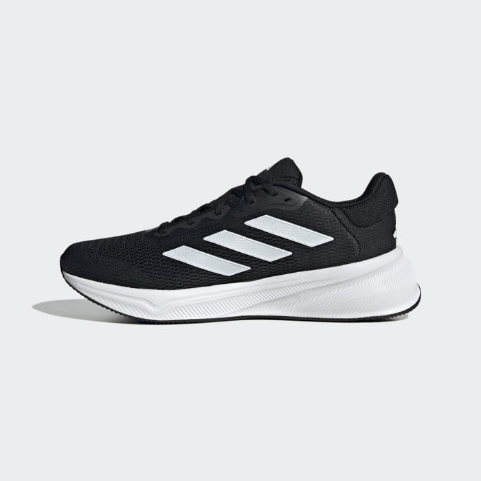 Adidas Response running shoes in black with white mesh upper, signature three-stripe design, and cushioned sole, side view.