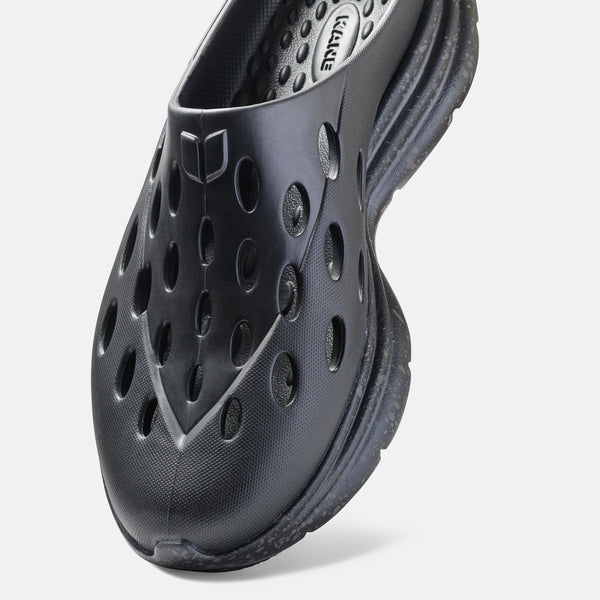Kane Revive OB recovery shoes in black with perforated design and textured sole, front angle view.