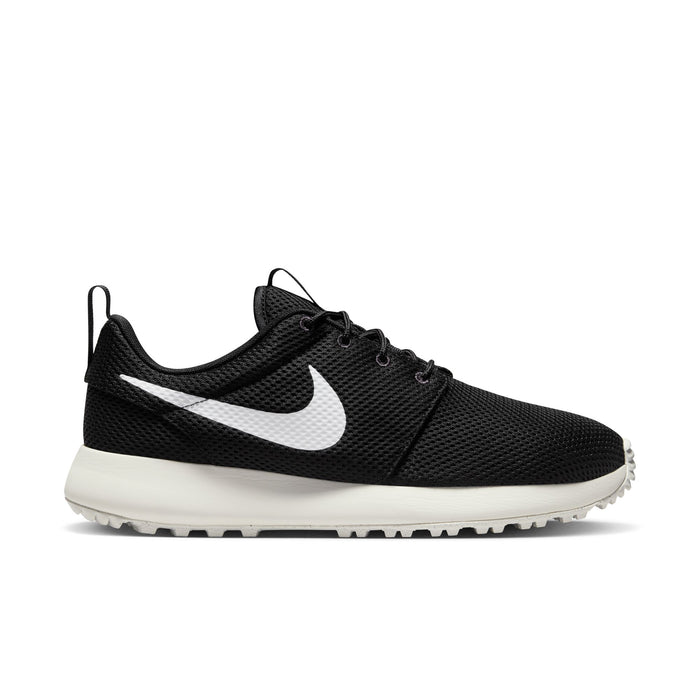 Nike Roshe Golf Next Nature golf shoes in black with a breathable mesh upper, white midsole, and Swoosh logo, side view.