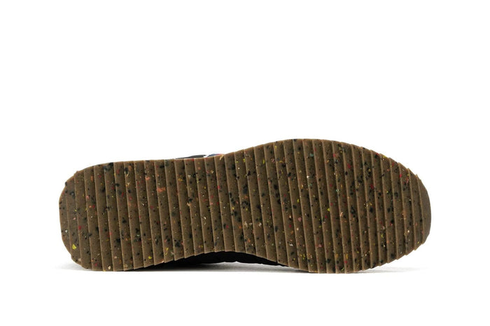 SeaVees Royal Runner shoe outsole in textured brown rubber with multicolor speckled detail and ribbed tread pattern.