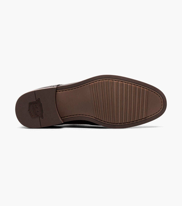 Florsheim Rucci Cap Oxford dress shoe outsole with textured grip and embossed logo in brown rubber.