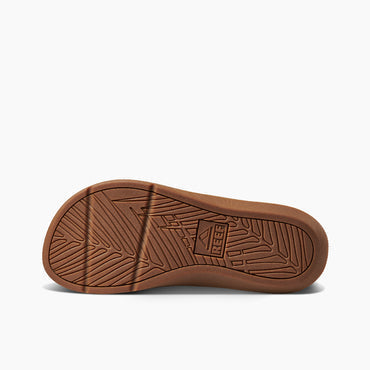 Reef Santa Anna sandal outsole in brown rubber showing textured tread pattern and brand logo.